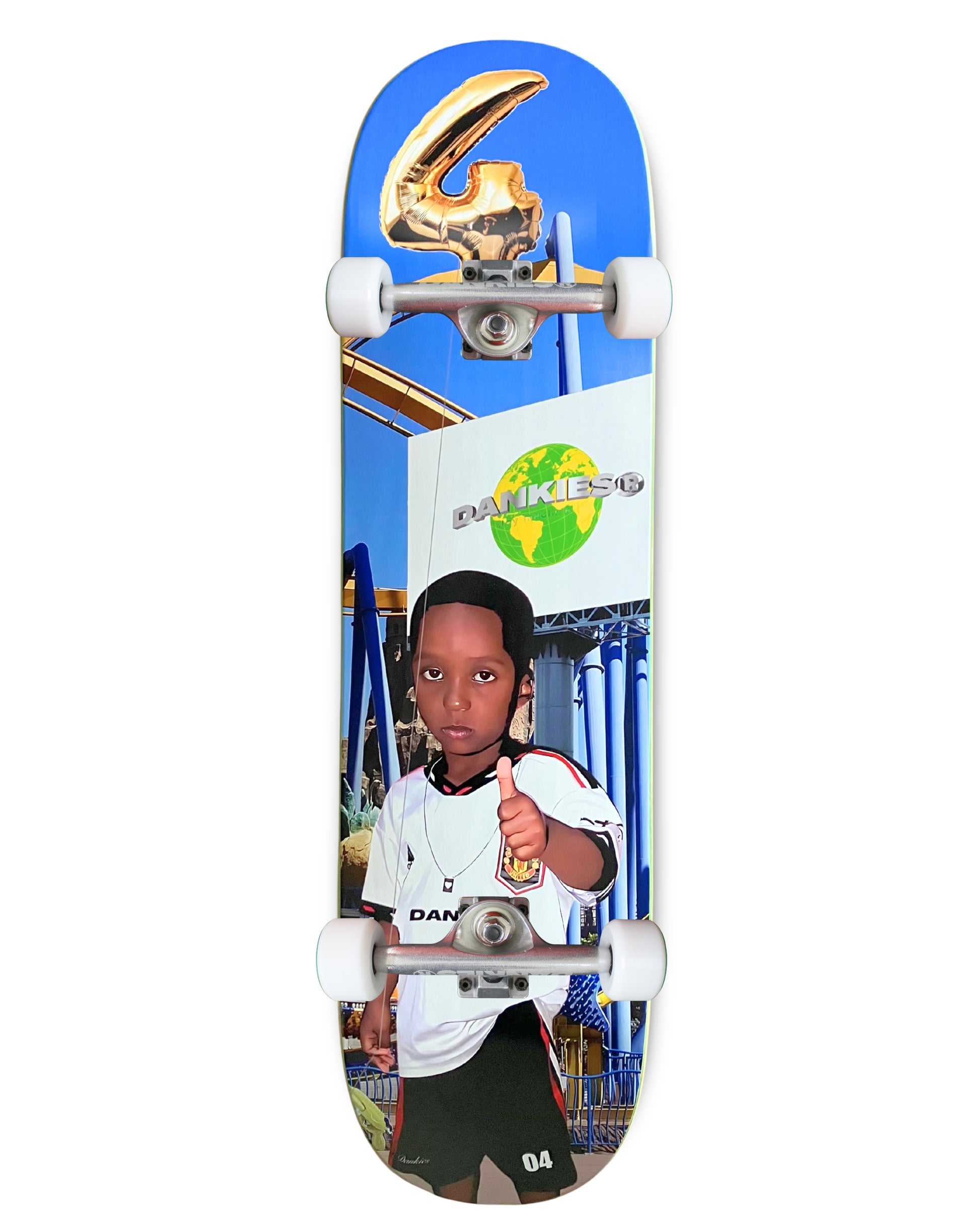 Dankies 4L Complete Skateboard with 4th Anniversary Graphic that features a kid holding a Number 4 balloon in a theme park