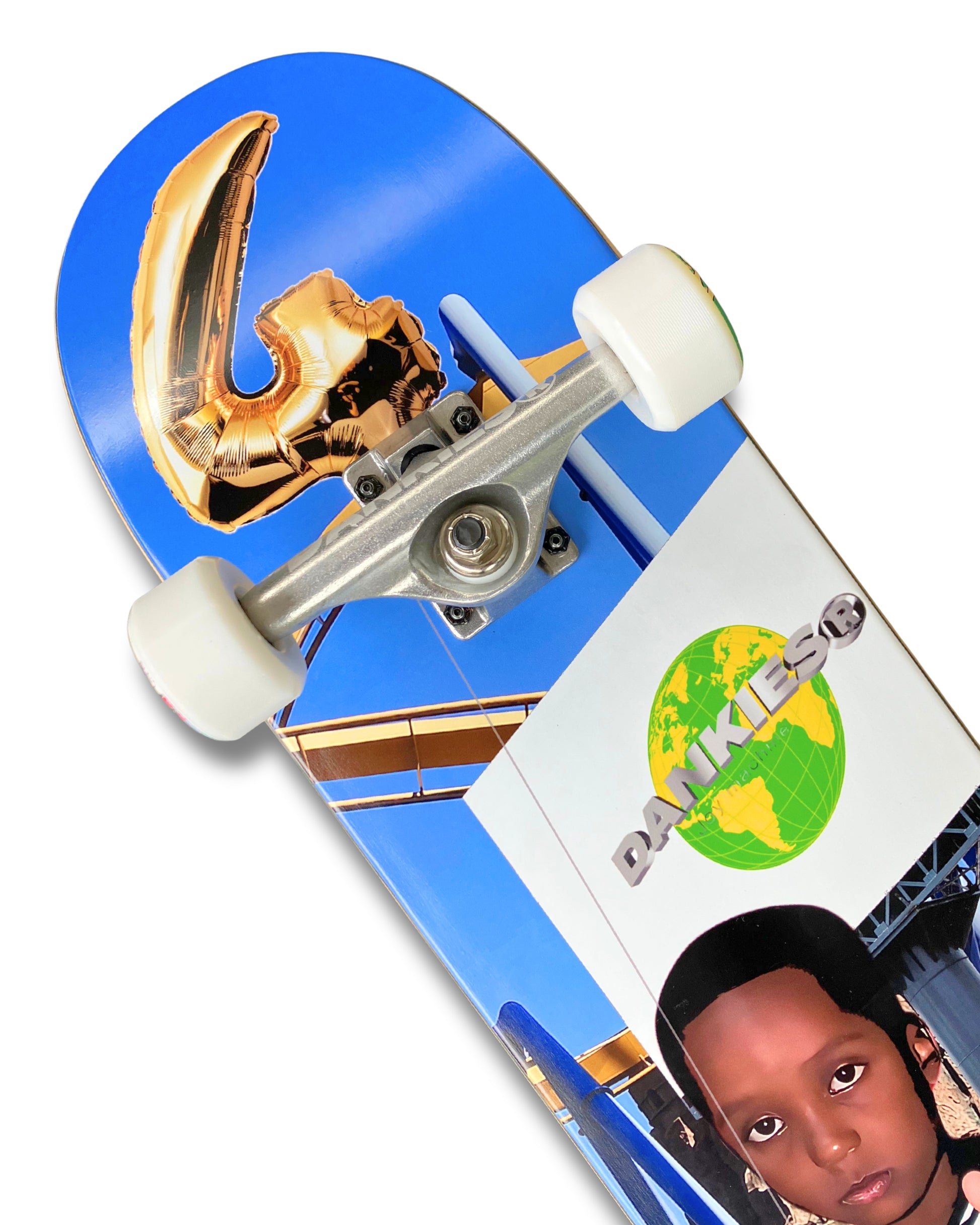 Dankies 4L Complete Skateboard with 4th Anniversary Graphic that features a kid holding a Number 4 balloon in a theme park - top