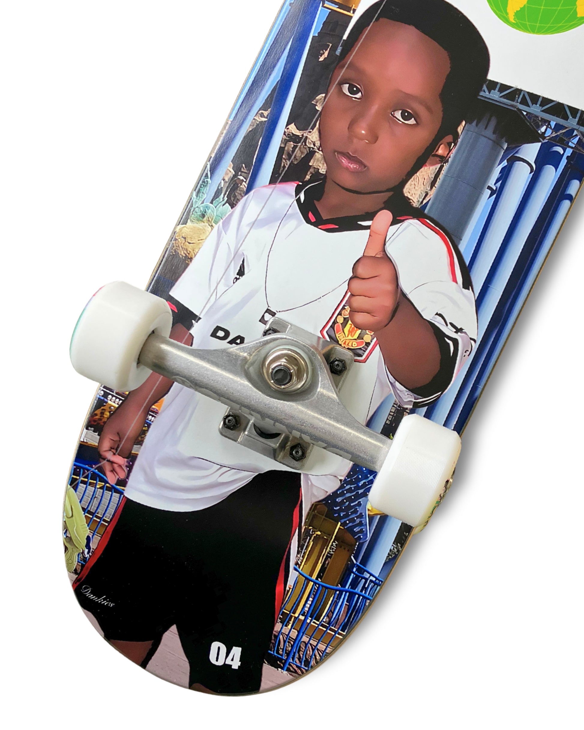 Dankies 4L Complete Skateboard with 4th Anniversary Graphic that features a kid holding a Number 4 balloon in a theme park - bottom