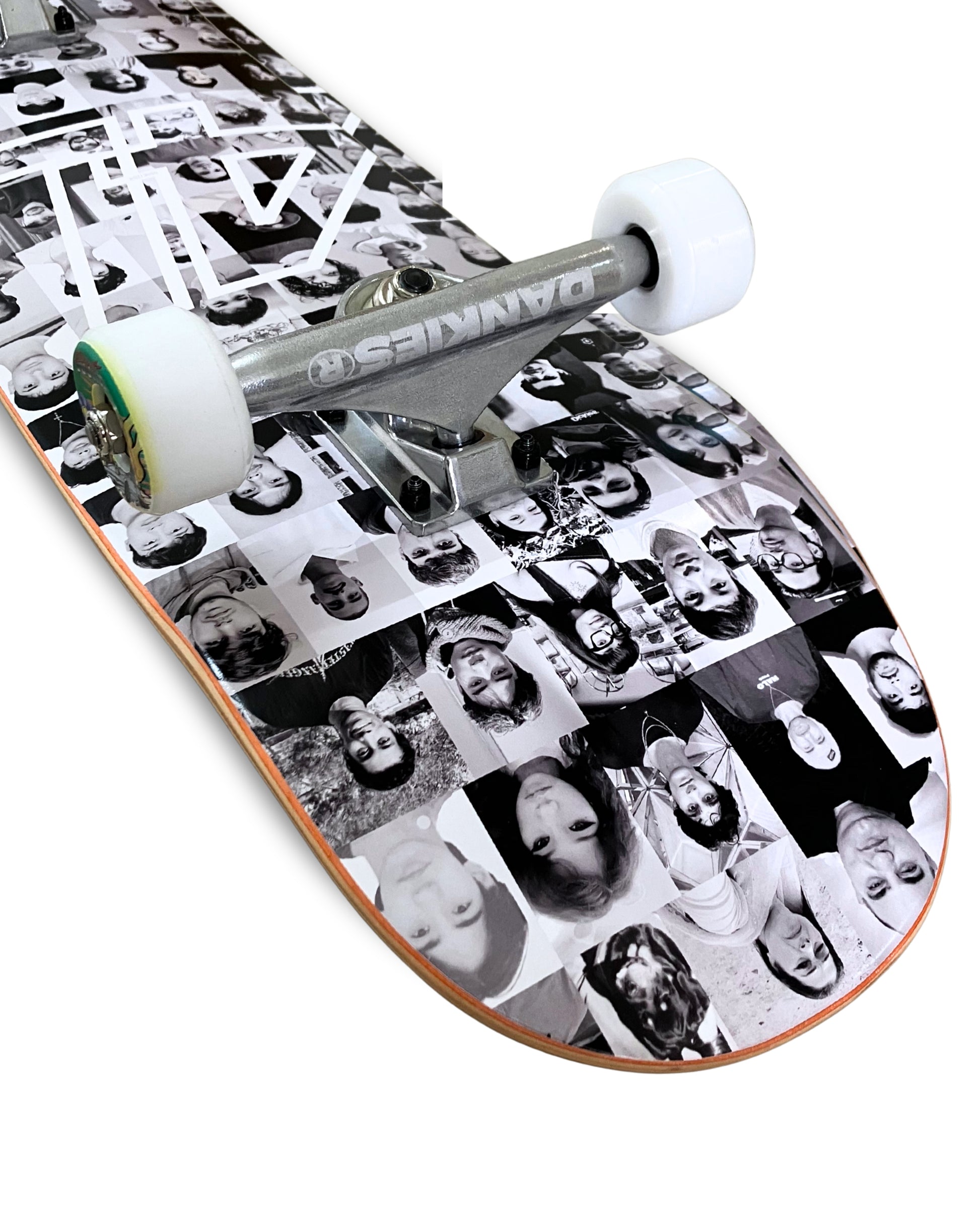 Dankies Class of 25' complete Skateboard with a collage of faces pattern on a white background - tilted angle top