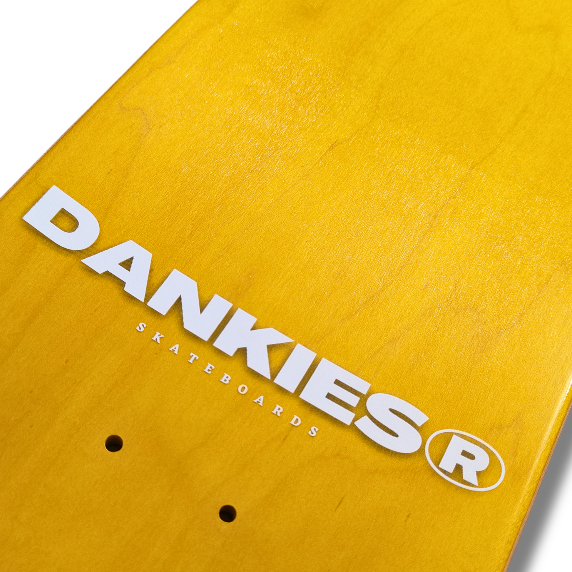 Dankies Logo Deck - Black Dankies Logo on Yellow Background - grip tape area - tilted angle from bottom