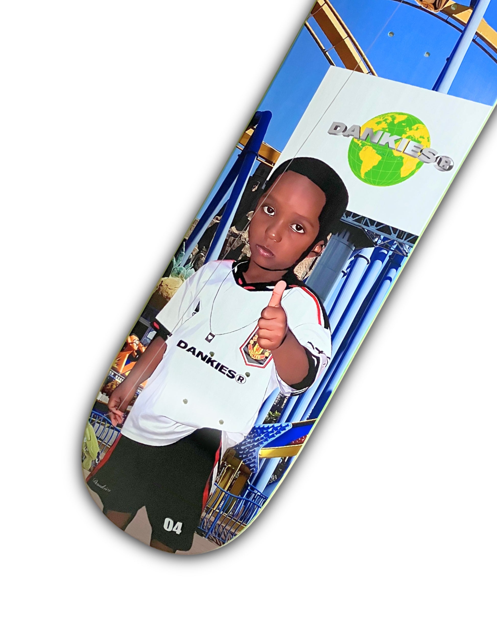 Dankies 4L Skateboard deck with 4th Anniversary Graphic that features a kid holding a Number 4 balloon in a theme park - bottom