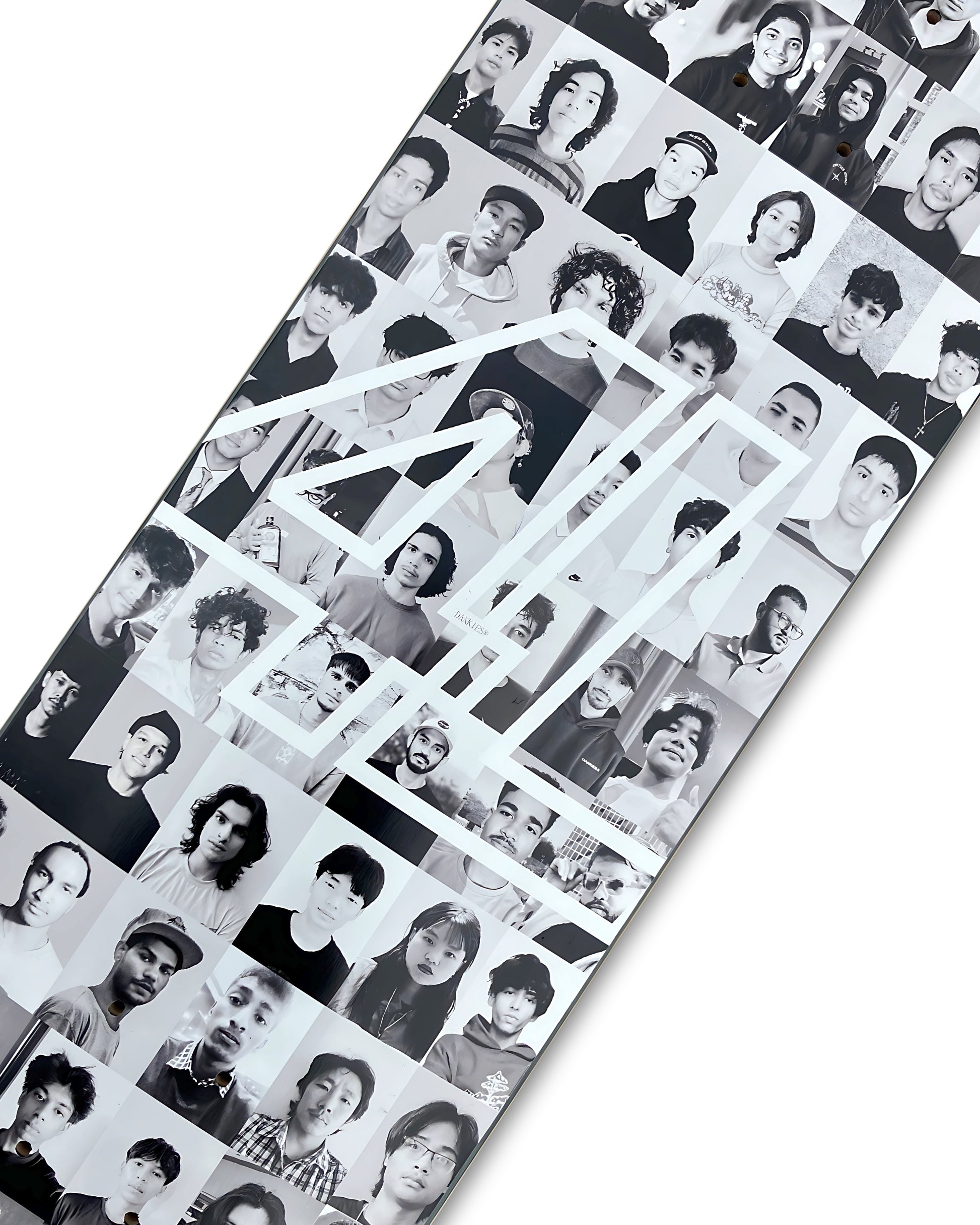 Dankies Class of 25' Skateboard deck with a collage of faces pattern on a white background - middle