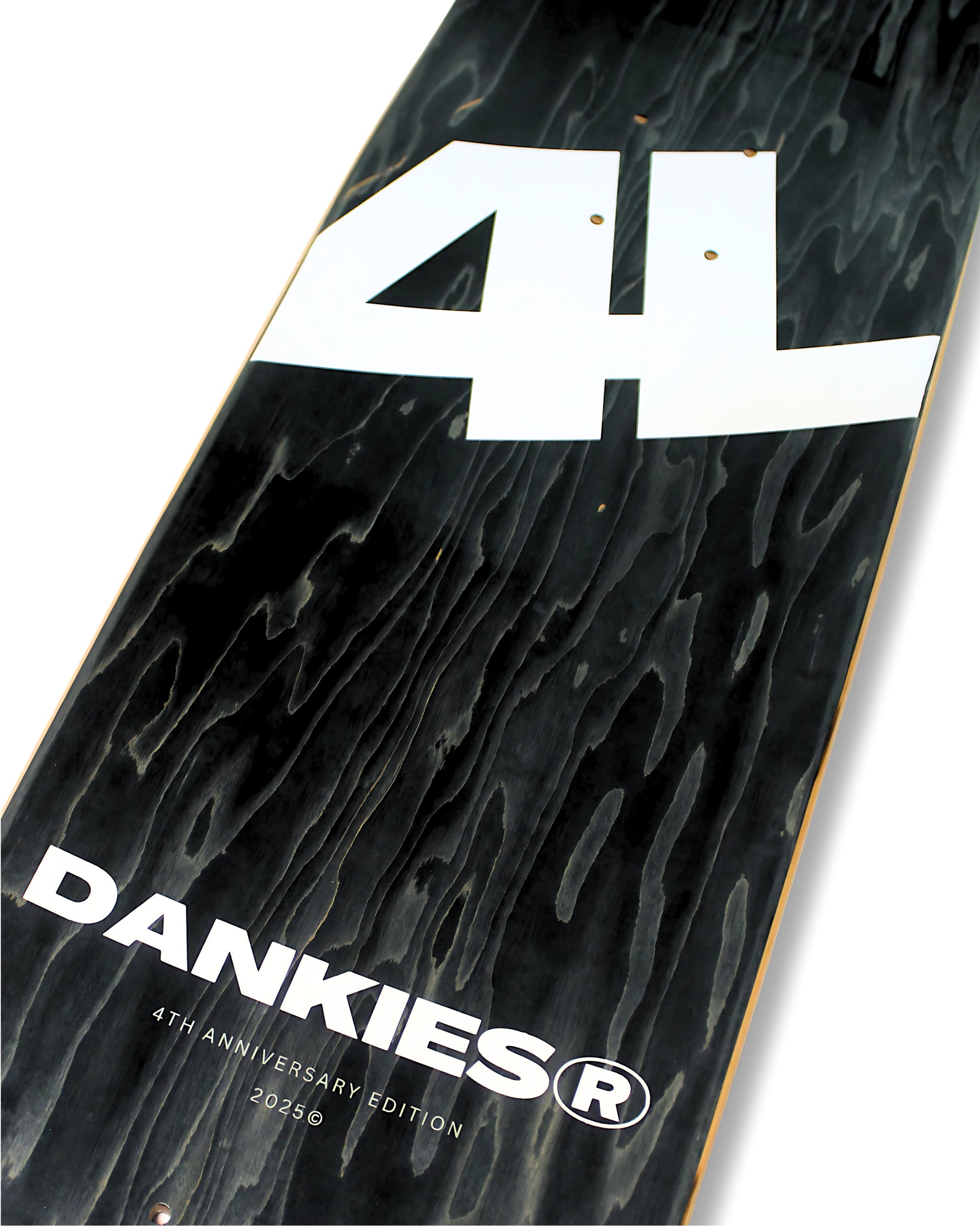 Dankies Class of 25' Skateboard deck with a collage of faces pattern on a white background - grip tape area - tilted angle bottom