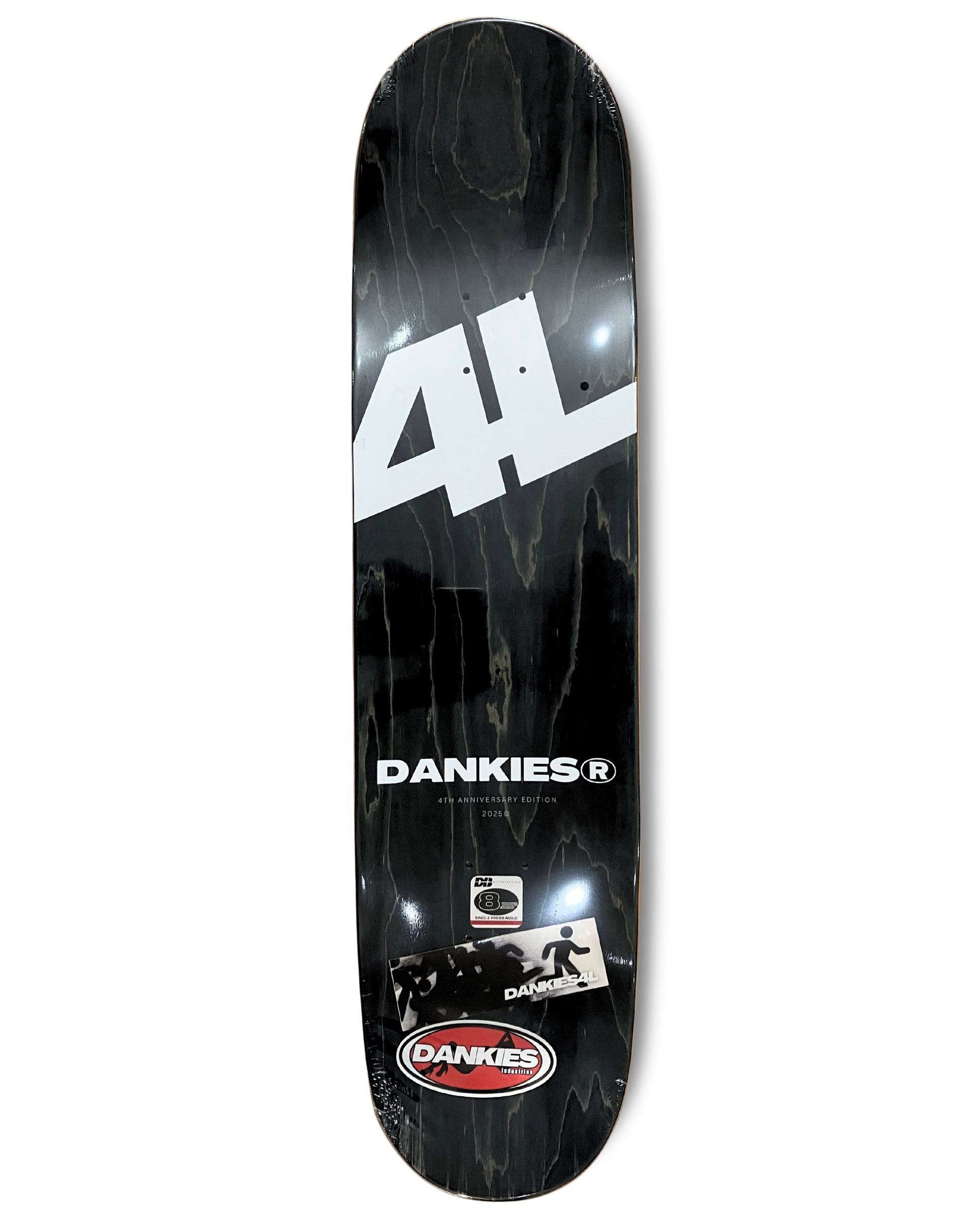 Dankies Class of 25' Skateboard deck with a collage of faces pattern on a white background - grip tape area